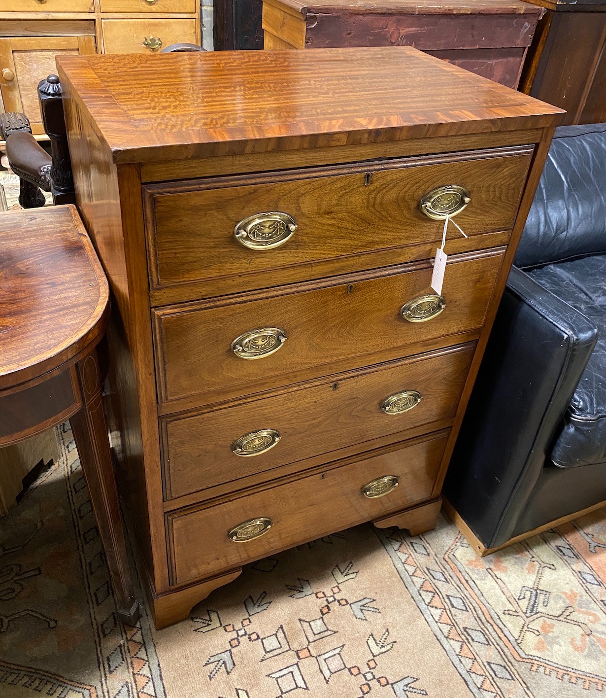 A small banded mahogany four drawer chest, width 67cm, depth 43cm, height 99cm